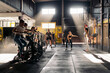 © Santi Nuñez/Stocksy - Sportspeople exercising in spacious gym