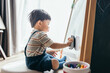 © Heng Yu/Stocksy - Asian little baby boy drawing