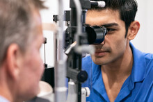 Eyewear: Staff Tech Checks Interior Of Eye With Slit Lamp