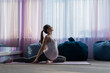 © Михаил Решетников - Beautiful young pregnant woman is engaged in pilates. The expectant mother plays sports while waiting for the birth of a child.