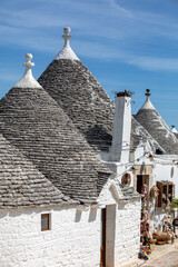 Wall Mural - Tradtional white houses in Trulli village. Alberobello, Italy. The style of construction is specific to the Murge area of the Italian region of Apulia