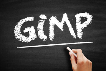Aufkleber - GIMP Gnu Image Manipulation Program - free and open-source raster graphics editor used for image manipulation and image editing, acronym text concept on blackboard