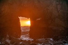 Telephoto Shot Of The Keyhole Arch, With The Sun Peeking Trough.