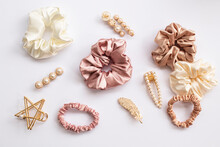 Collection Of Trendy Silk Elastic Band Scrunchies And Pearl Hair Clips On White Background. Diy Accessories And Hairstyles Concept, Luxury Color