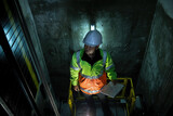 Fototapeta  - People in elevator shaft. service engineer checking inspector part of  elevator. worker check in lift shaft.