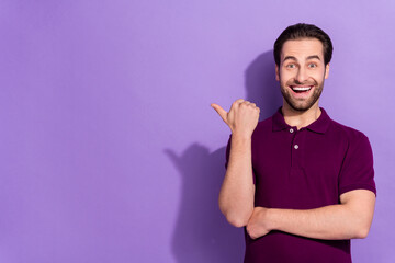 Wall Mural - Photo of impressed millennial brunet guy index promotion wear purple t-shirt isolated on violet color background