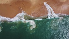 Sea Coast, View From The Height. Yellow Sandy Beach With Blue Sea. A Deserted Beach With A Bird's Eye View. Sea Waves Roll On The Sandy Beach. Beautiful Sea Landscape. Ocean, Waves, Sand. Aerial