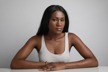 Wall Mural - Pretty young woman posing on white background. Long hair and ideal skin.