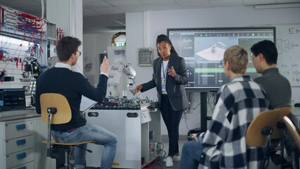 Aufkleber - University Robotics Class: Black Teacher Explaining Engineering to Students Using Robot Arm. Diverse Group of Young Engineers Programming Robotic Hand. Computer Science Education Build, Design, Learn