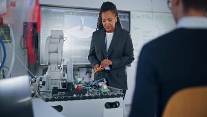 Aufkleber - Chief Engineer Presents Innovative Robot Arm to Start-up at Conference. Futuristic Design of AI Robot Hand, Helping to Automate Factory Working. Advanced Robotics Technology Concept