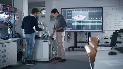 Leinwandbilder - Industry High-Tech Factory at School: Diverse Team of Future Robotics Engineers Working on Robot Arm Design. They Discussing and Giving Five to Each Other. Digital Technology Concept