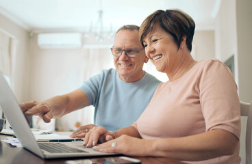 Wall Mural - Our plans seem to shaping up. Shot of a mature husband and wife using a laptop together.