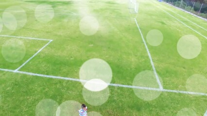 Wall Mural - Animation of light spots over diverse schoolchildren running at stadium