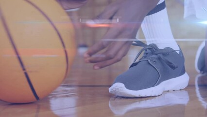 Poster - Animation of light spots over diverse schoolchildren playing basketball at gym