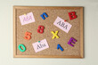 Applied behavior analysis concept. Paper notes with abbreviation ABA, colorful letters and numbers on corkboard