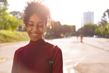 Fototapeta  - African American young woman portrait outdoors in urban landscape