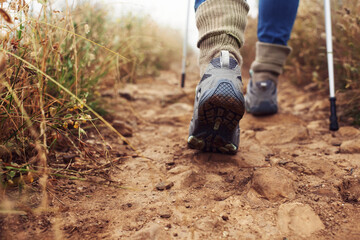 Canvas Print - Sure-footed fitness. Cropped rear view of a hiker walking along a trail.