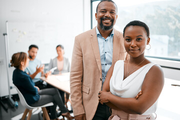 Poster - Great teams make great companies. Cropped portrait of two businesspeople attending a meeting in the boardroom with their colleagues in the background.
