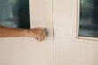 Woman opening or closing the door with her hand