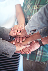 Poster - This team has each others backs. Closeup shot of a group of coworkers with their hands in a huddle.