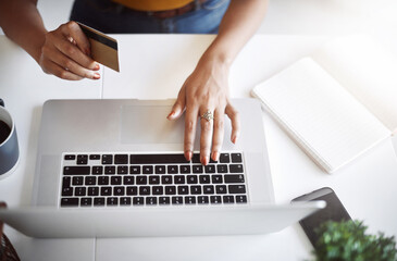 Aufkleber - Thanks to technology, shopping has never been this easy. High angle shot of an unrecognizable female designer shopping online in her home office.