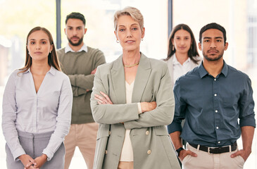 We make a powerful team. Shot of a diverse group of businesspeople standing together in the office.