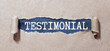 Testimonial - word from wooden blocks with letters, statement about the character or qualities testimonial concept