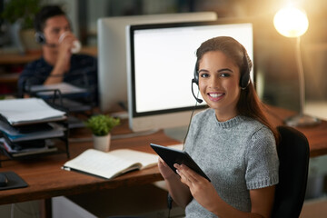 Canvas Print - Looking up ways to help the customer even more. Shot of young agents working in a call center.