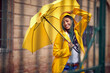 Woman with yellow umbrella outdoor
