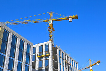 Wall Mural - Crane and highrise construction site