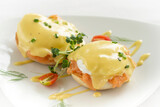 Fototapeta Uliczki - eggs benedict royale breakfast with smoked salmon and hollandaise sauce