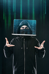 Fototapete - bending your data to his will. portrait of a computer hacker levitating a laptop while standing agai