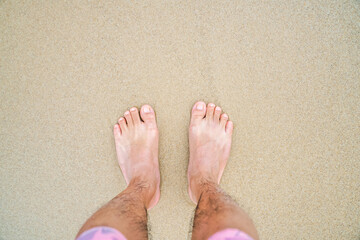 Wall Mural - barefoot on the yellow clean beach