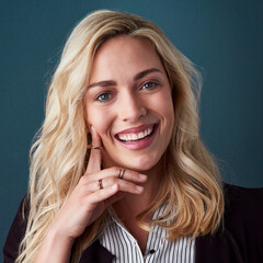 Poster - Think about the business you want then start it. Studio shot of a beautiful young businesswoman posing against a blue background.