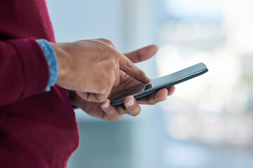 Aufkleber - His office is wherever he is. Shot of an unidentifiable businessman using his smartphone in the office.
