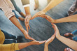 © Camerene Pendl/peopleimages.com - Were all in it to make a success. High angle shot of a group of unidentifiable businesspeople forming a circle with their hands.