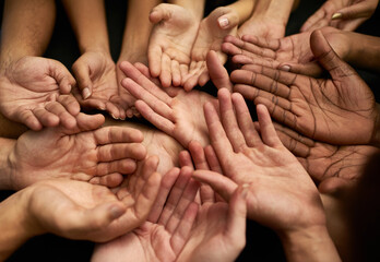Poster - Support a good cause. Shot of a group of hands held cupped out together.