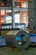 Roll of steel sheet in a plant. Rolls of sheet steel of Factory. Coils of steel stripes in store
