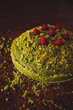 Forest Moss Cake, a delicious and light cake with a lemony mascarpone cream filling. This cake is naturally green due to the added spinach. topped with raspberries