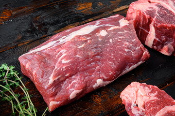 Wall Mural - Fresh and raw fillet meat. Whole piece of beef tenderloin steaks, on old dark  wooden table background