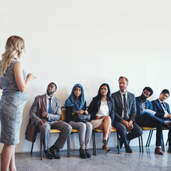 Thank you all for your patients. Shot of a group of confident businesspeople waiting in line for their interviews inside of a office during the day.