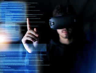 Poster - Only the latest tech will do. Shot of a young computer programmer wearing a vr headset while working on his code.
