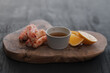 Crab served with sauce and sweet lemon on olive wood board
