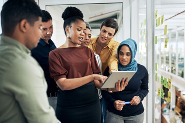 Poster - technology helps them better understand their big plans. shot of a group of businesspeople using a d