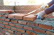 Close up of bricklayer building walls