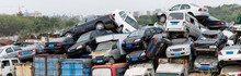 A Pile Of Abandoned Cars On Junkyard