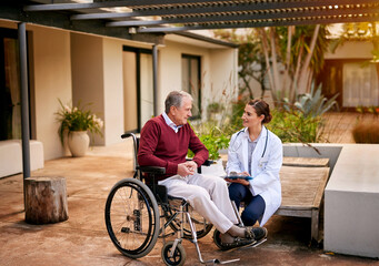 Canvas Print - He trusts her expertise implicitly. Shot of a young doctor and her elderly patient talking while sitting outside.