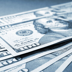 Wall Mural - american paper money. several one hundred dollar notes lie on textured surface. focus on the number 