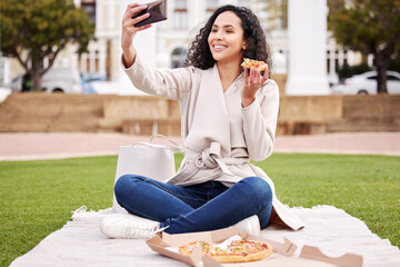 Wall Mural - Break time is pizza time. Shot of an attractive young female university student taking selfies outside on campus during her break.