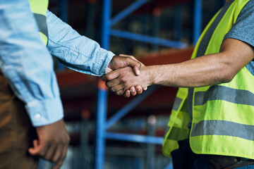 Aufkleber - Proud to have a reliable partner like you. Shot of two builders shaking hands at a construction site.